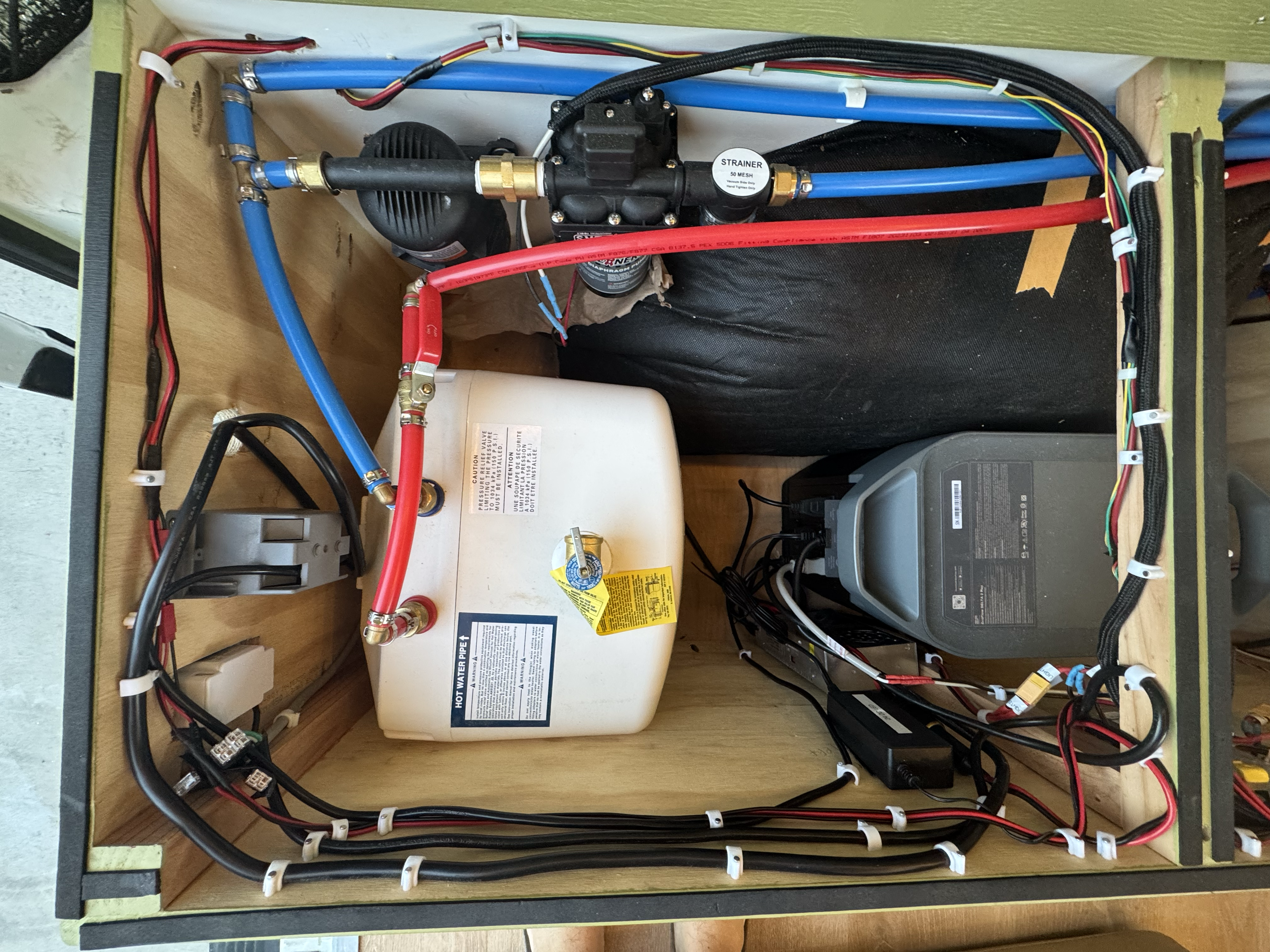 Electrical and plumbing systems cabinet